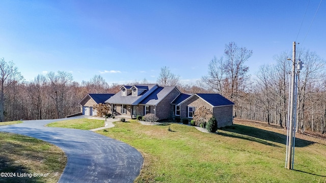 view of front of property with a front yard and a garage