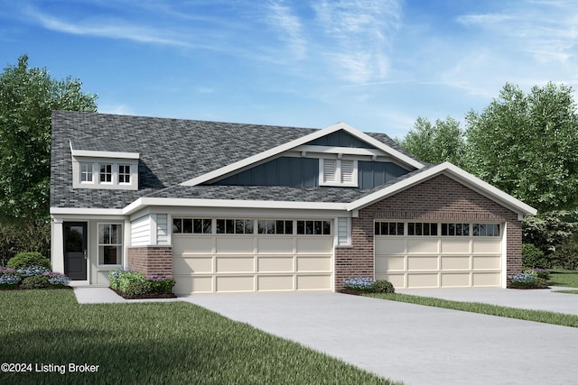 view of front of property with a garage and a front lawn