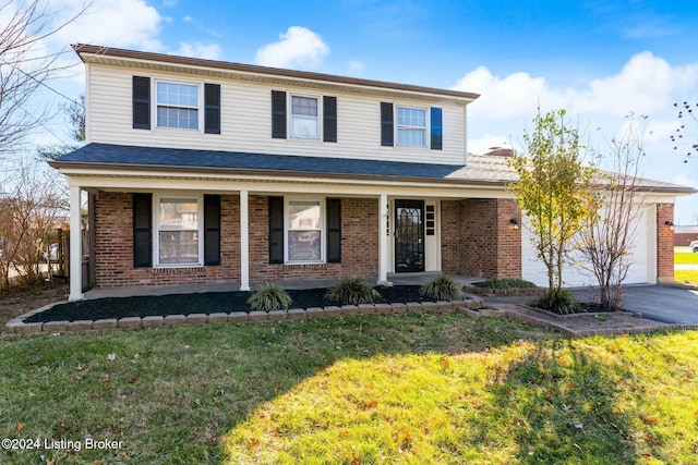 front facade featuring a porch and a front yard