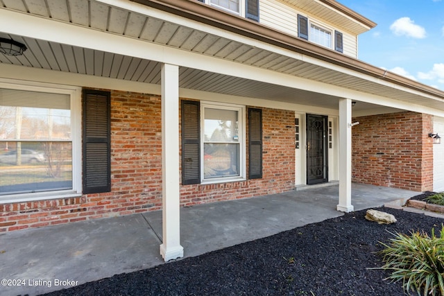 doorway to property featuring covered porch