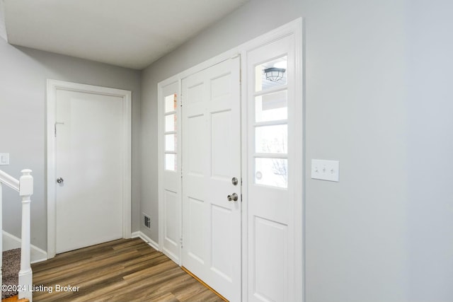 foyer with dark hardwood / wood-style flooring