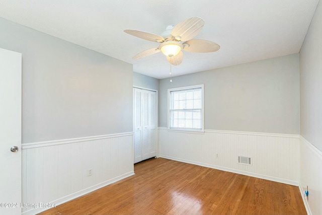 unfurnished room with ceiling fan and light hardwood / wood-style flooring