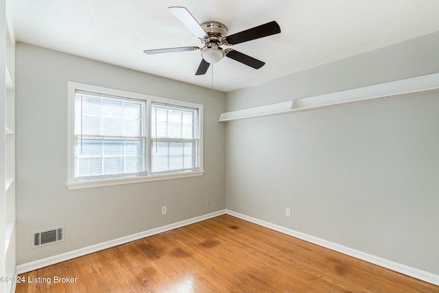 unfurnished room with light wood-type flooring and ceiling fan