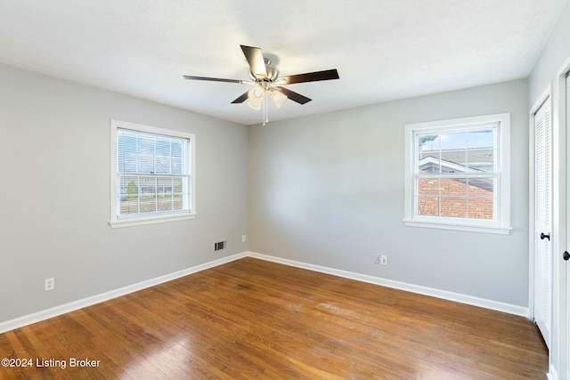 empty room featuring ceiling fan and wood-type flooring