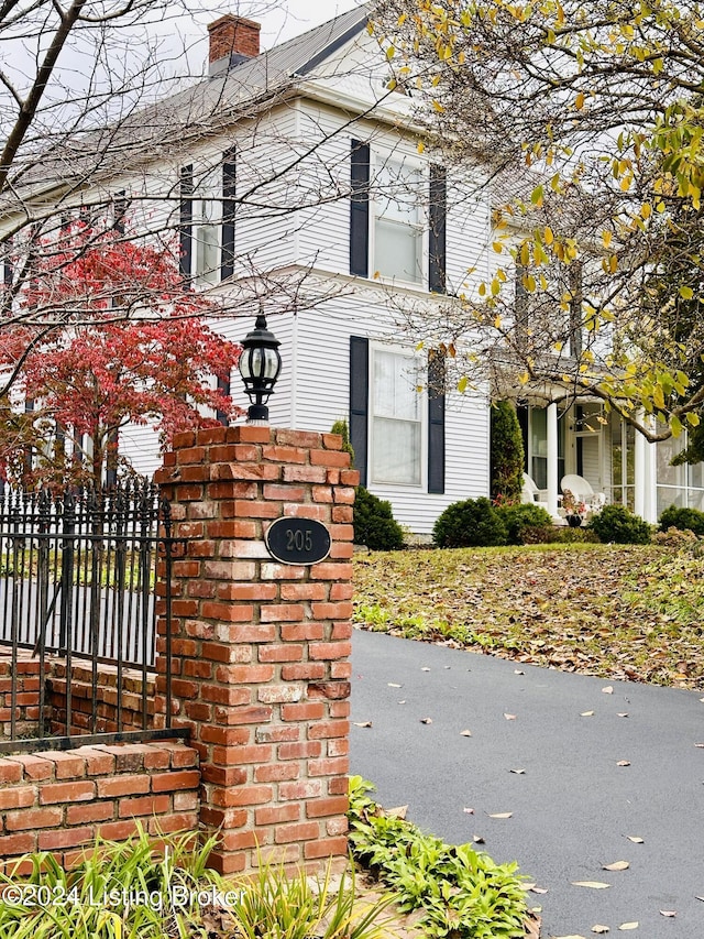 205 W Chestnut St, Leitchfield, KY 42754 - view of home's exterior with a chimney