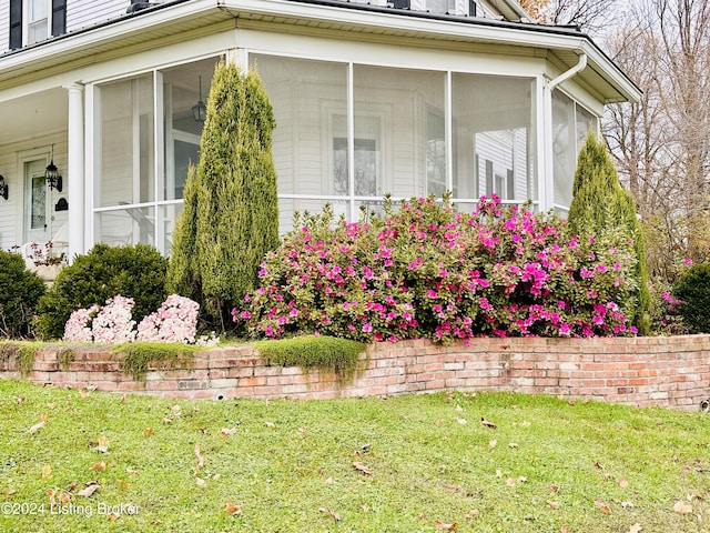 205 W Chestnut St, Leitchfield, KY 42754 - view of home's exterior featuring a sunroom and a lawn