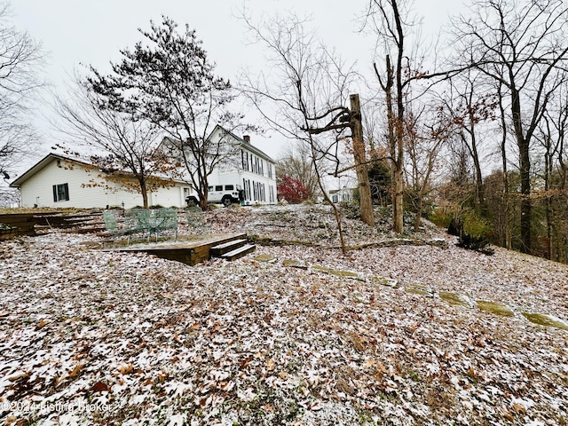 view of yard layered in snow