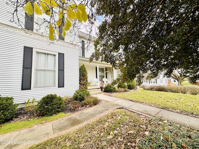 205 W Chestnut St, Leitchfield, KY 42754 - view of front facade with covered porch and a front yard