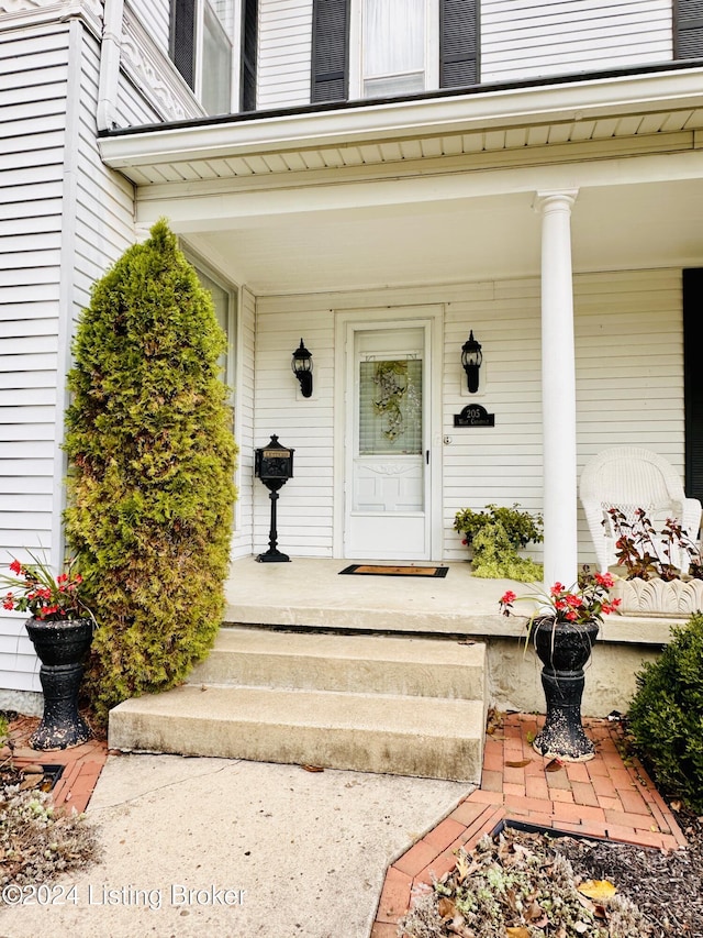 205 W Chestnut St, Leitchfield, KY 42754 - doorway to property with covered porch