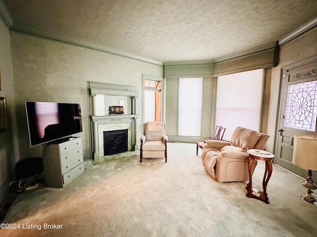 living room featuring carpet flooring, a textured ceiling, and ornamental molding