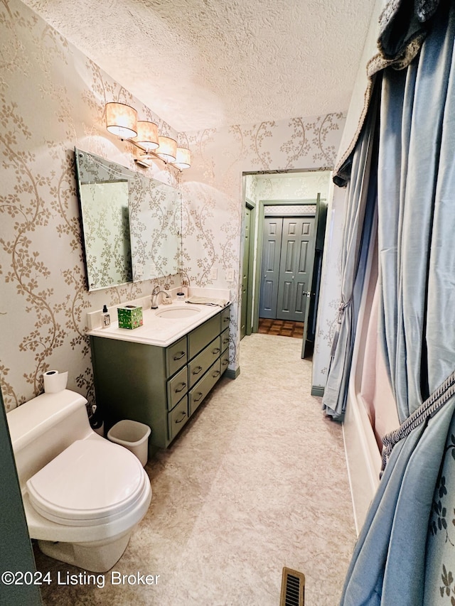 full bathroom with shower / bathing tub combination, vanity, toilet, and a textured ceiling