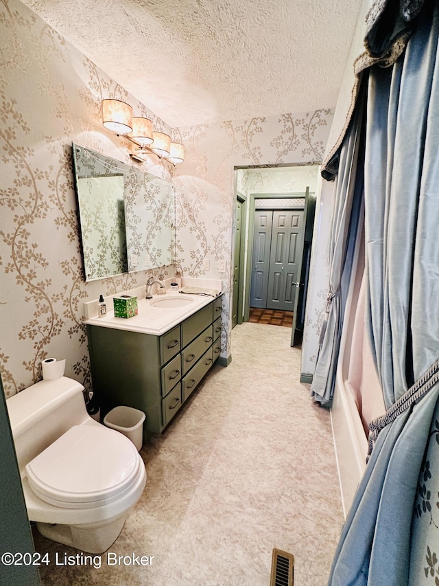 205 W Chestnut St, Leitchfield, KY 42754 - full bathroom with wallpapered walls, vanity, and a textured ceiling