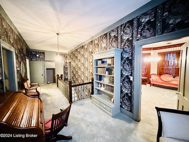 interior space featuring carpet and an inviting chandelier