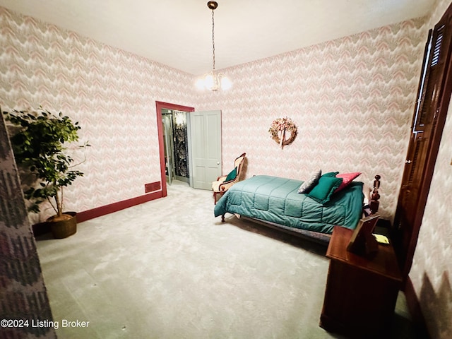 bedroom with carpet and an inviting chandelier