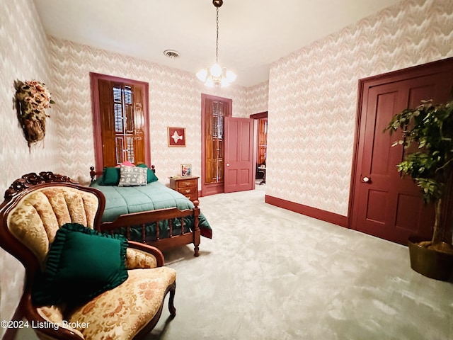 bedroom with carpet and an inviting chandelier