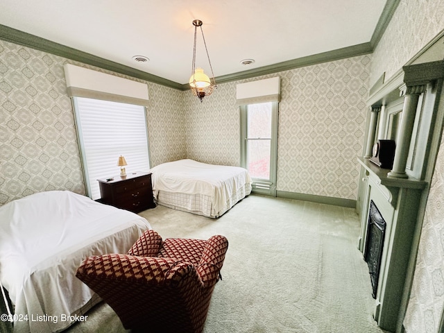 carpeted bedroom with ornamental molding