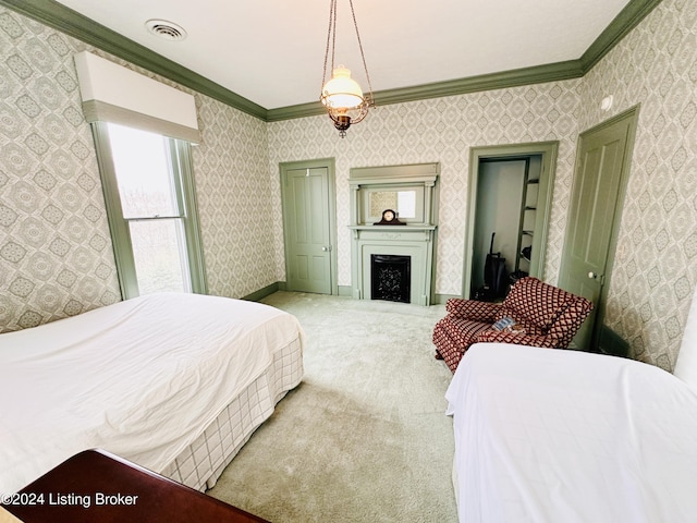 carpeted bedroom with ornamental molding