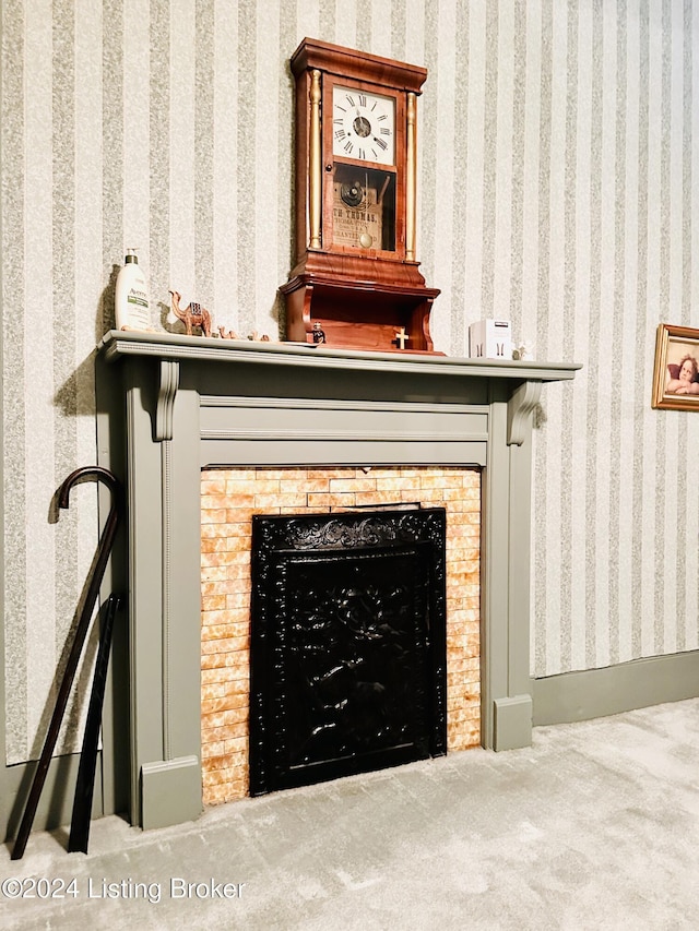 room details featuring carpet floors and a fireplace