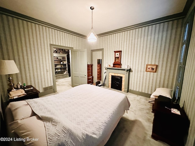 bedroom featuring light colored carpet and ornamental molding