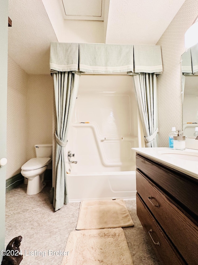 full bathroom featuring vanity, toilet, shower / bathtub combination with curtain, and a textured ceiling