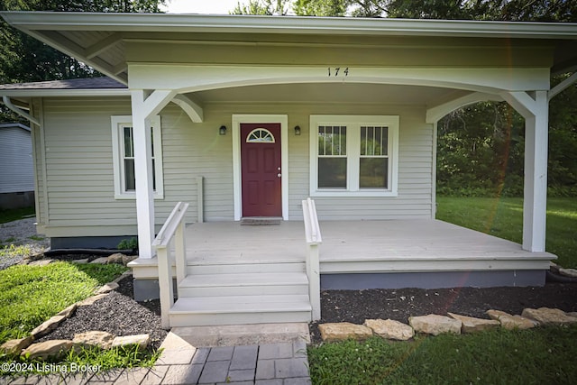 doorway to property featuring a porch