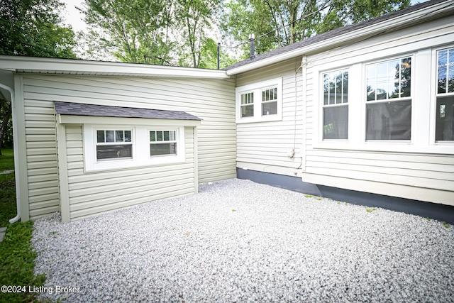 view of property exterior with a patio