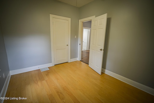 empty room with light wood-type flooring