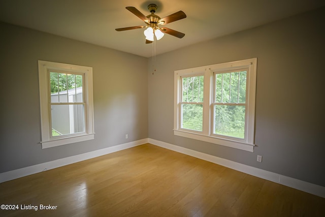 unfurnished room featuring light hardwood / wood-style floors and ceiling fan