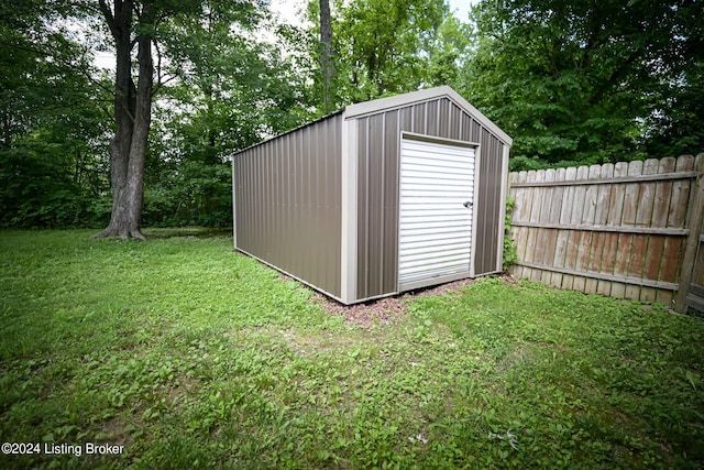 view of outdoor structure with a lawn