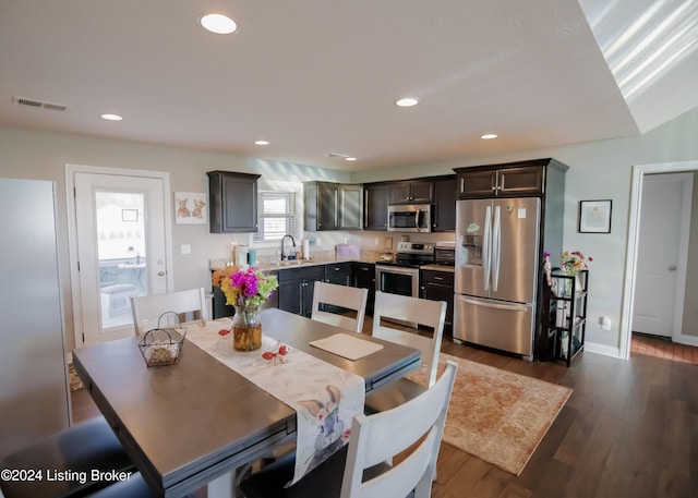 dining room featuring sink and dark hardwood / wood-style floors