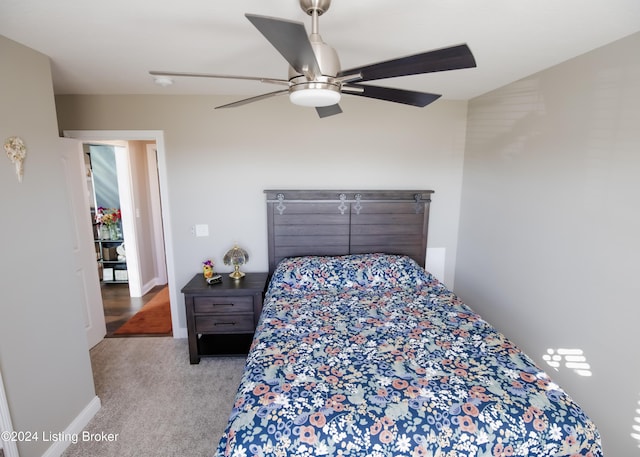 bedroom with ceiling fan and light carpet