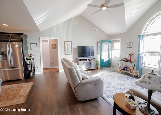 living room with high vaulted ceiling, ceiling fan, and dark wood-type flooring