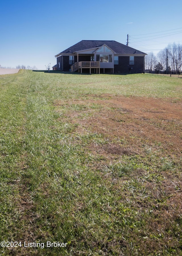 view of yard with a wooden deck