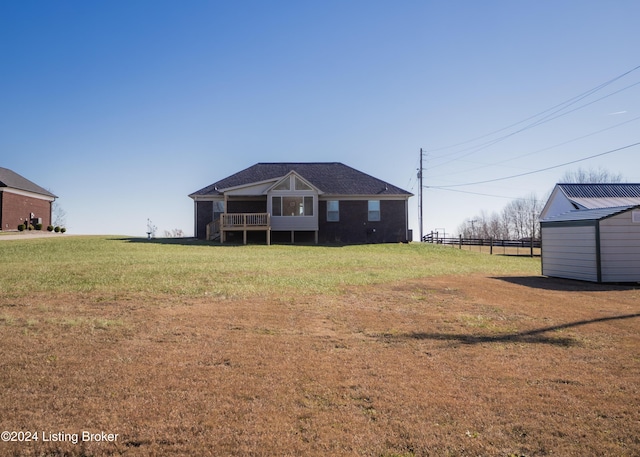 back of house with a yard