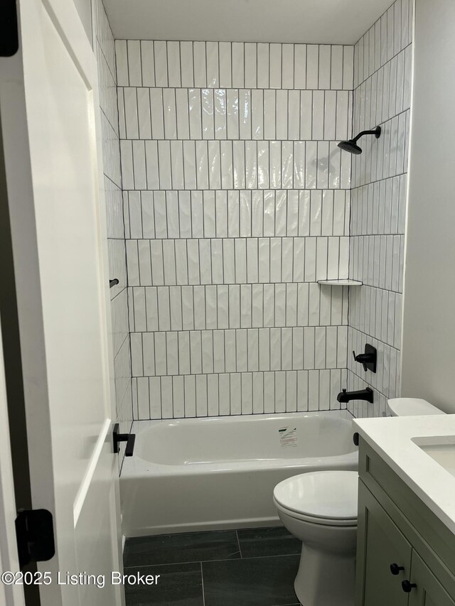 full bath with shower / bath combination, vanity, and toilet