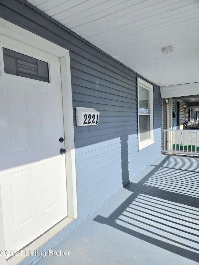 doorway to property with a porch