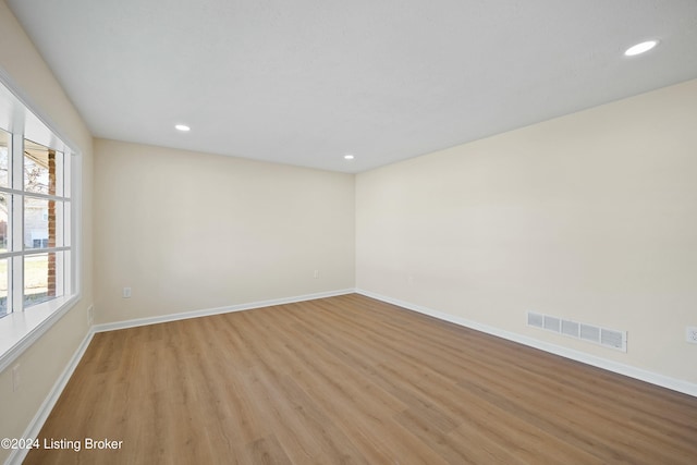 unfurnished room featuring light hardwood / wood-style flooring