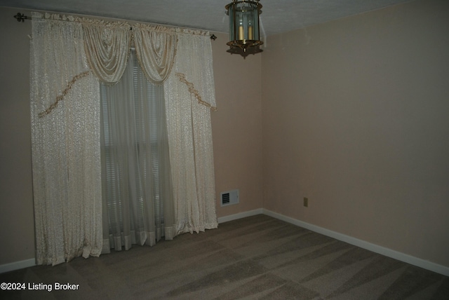 empty room with carpet flooring