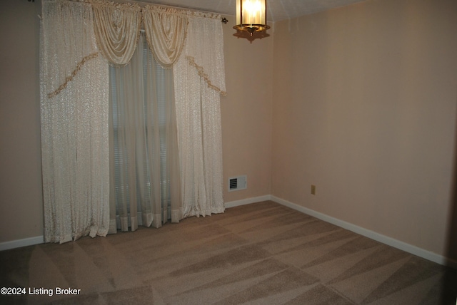 view of carpeted spare room