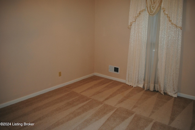 unfurnished room featuring carpet floors