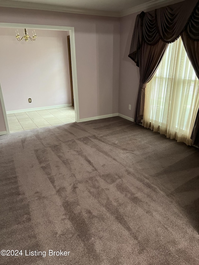 carpeted empty room with ornamental molding