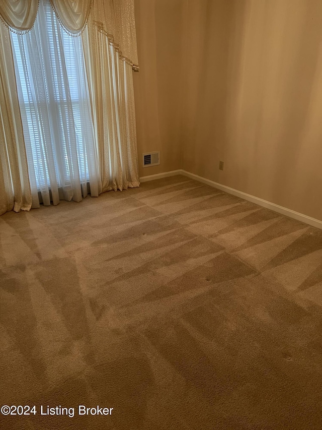 view of carpeted spare room