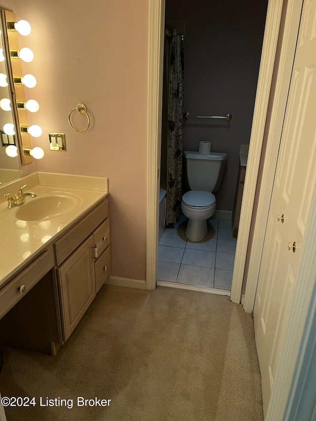 full bathroom featuring tile patterned flooring, vanity, toilet, and shower / bathtub combination with curtain