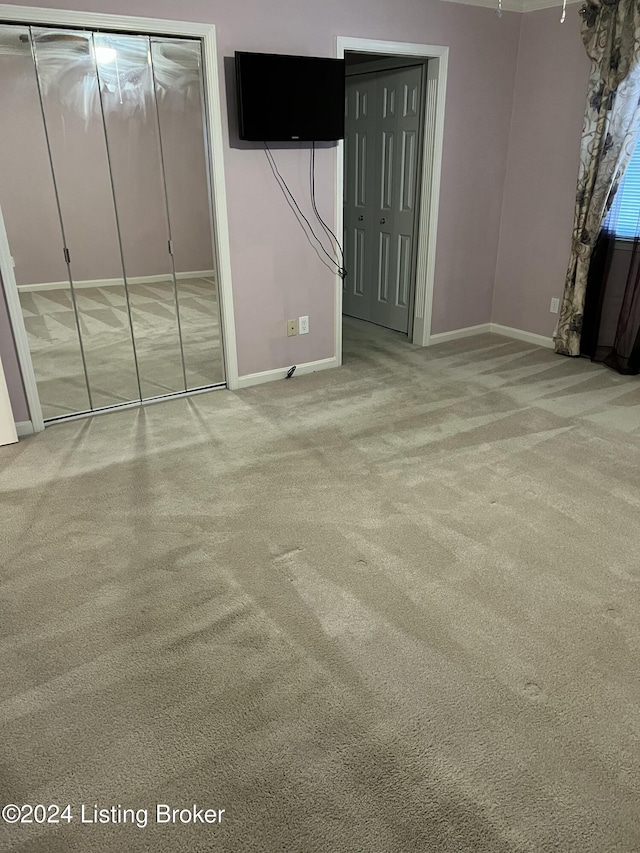 unfurnished bedroom featuring carpet