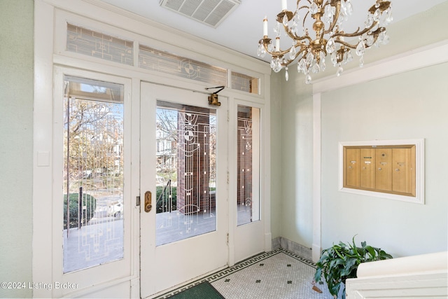 doorway to outside with a chandelier