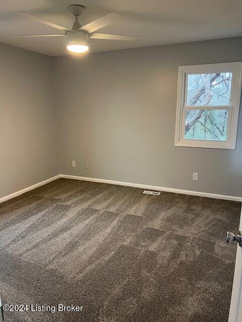 carpeted empty room with ceiling fan