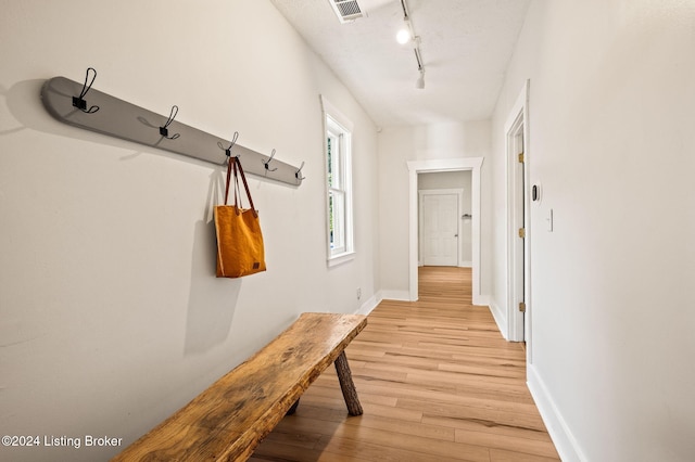 mudroom featuring light wood-type flooring and track lighting