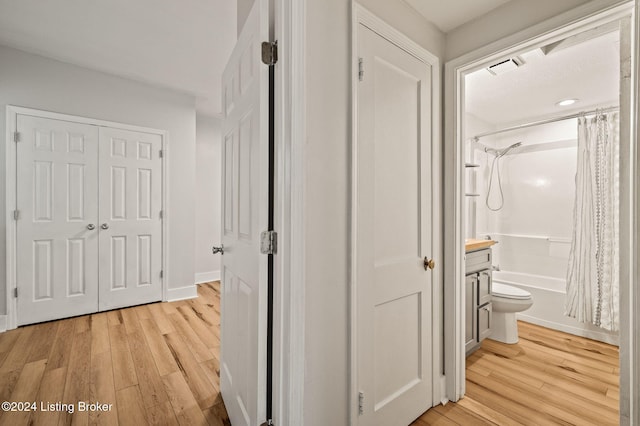 corridor featuring light hardwood / wood-style flooring