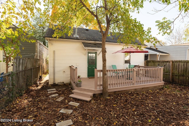 back of property featuring a wooden deck