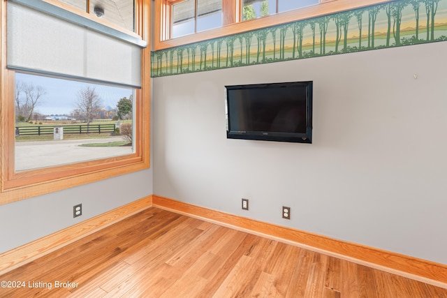 spare room with hardwood / wood-style flooring